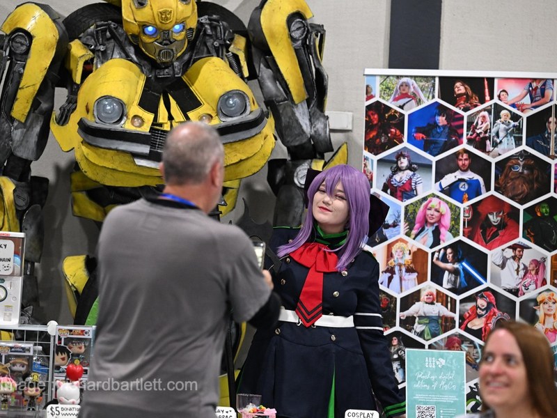 Life-size Bumblebee build behind a cosplay stall